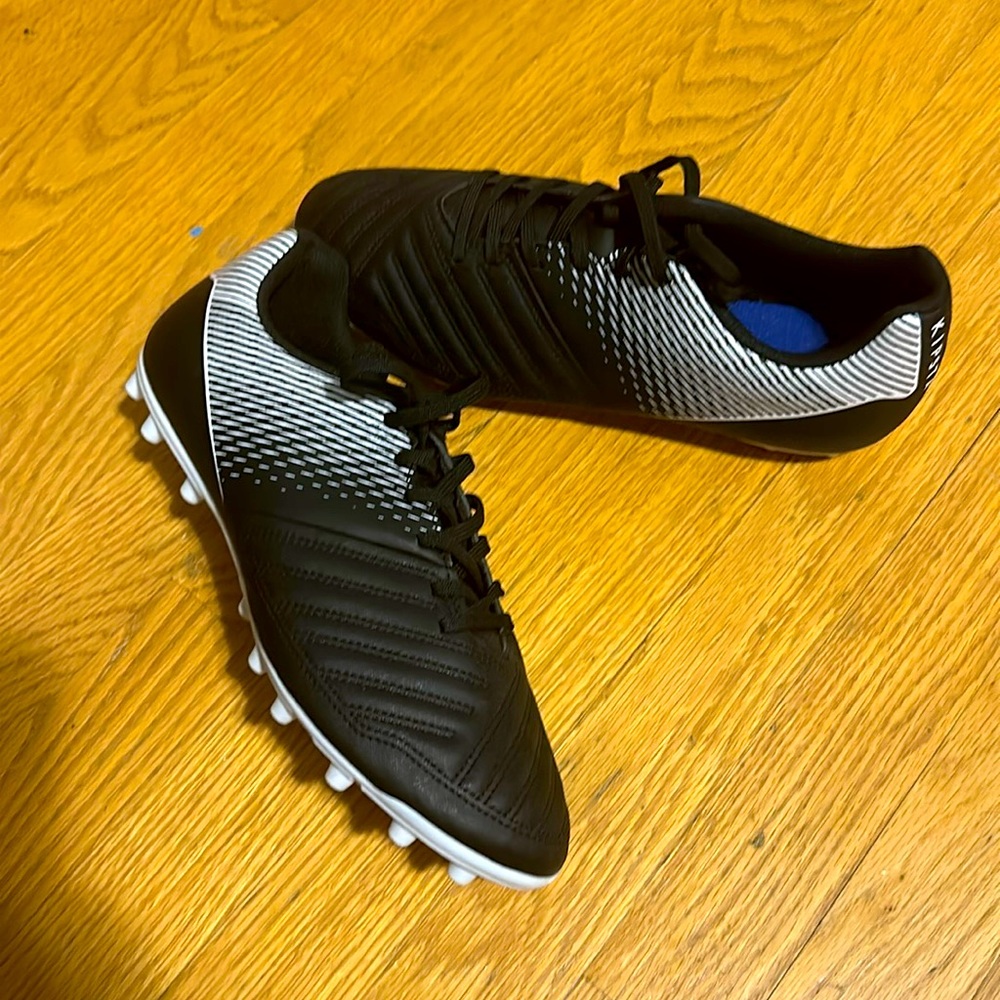 Kipsta black and white cleats 9.5 US never worn.